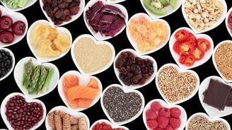 a variety of fruits and vegetables in bowls