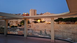 a view of a city with a clock tower in the background