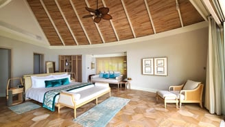 Milaidhoo Maldives beach villa bedroom