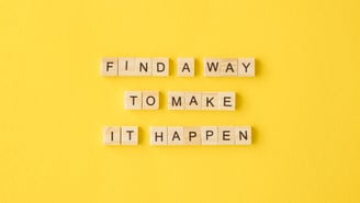 Motivational text on yellow background.
