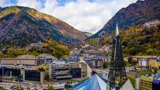 a view of a mountain range with a church steeple