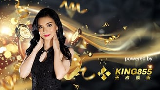 a woman in a black dress holding a casino chip