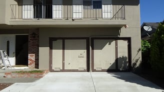 2 single one piece garage doors.