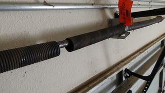 Broken garage door torsion spring