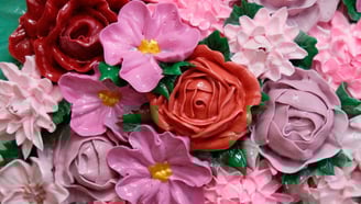 a bouquet of flowers that is decorated with pink and purple flowers