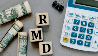 a calculator paperclip and money for required minimum distributions