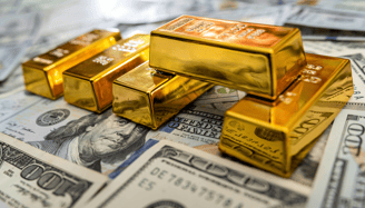 high quality gold bullion bars on top of US money