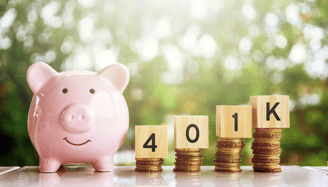piggy bank and 401k blocks on gold coins