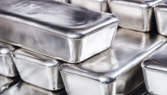 big silver bullion bars in stacks