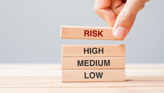 wooden blocks labeled with different risk tolerance levels