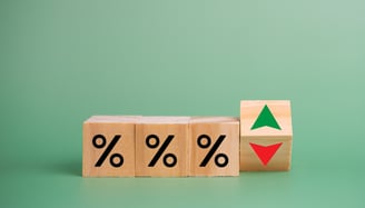 interest rate symbols with a red arrow going down for rate cuts