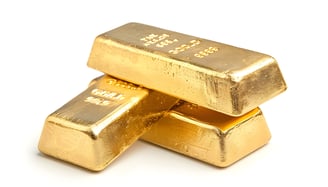 gold bars stacked on top eachother
