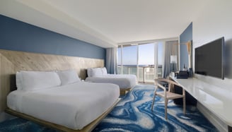 Architectural photo of modern hotel room with ocean view.