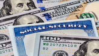 a hundred dollar bill and social security card for social security benefits