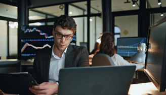 an expert investor looking at hedge fund charts and data