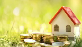 coins and a house for real estate investing