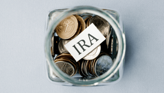 coins in a jar for an individual retirement account