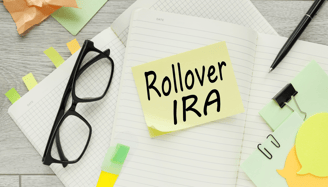 glasses and sticky notes for performing rollover to roth ira