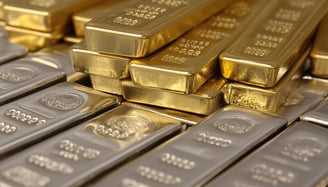 gold and silver bullion bars in multiple stacks