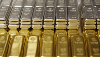 gold and silver bullion bars in rows and stacks