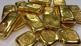 big pile of gold bullion for investing