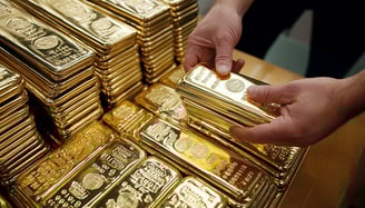 gold bullion bars in stacks