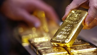 high quality gold bar being held