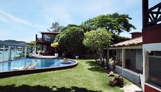 a pool with a boat in the background