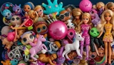 a bunch of dolls dolls and toys on display