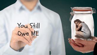 a woman holding a jar with a woman inside