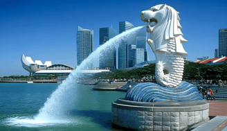 Iconic Merlion statue with water spewing, symbolizing Singapore's cultural heritage and modern sky