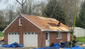 A house during a roofing job