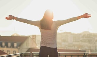 a woman with her arms outstretched out and arms outstretched out, with her arms outstretched