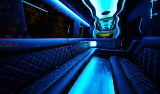 The inside of a party bus with blue neon