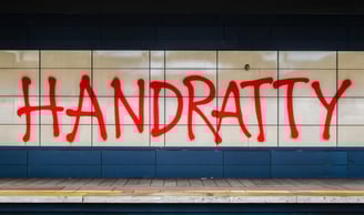 a subway station with graffiti on the wall