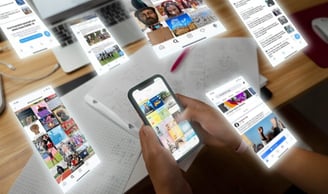image of a person holding a phone looking at social media