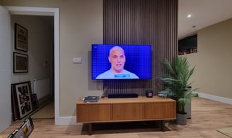 a bespoke feature wall with television and AV cabinet