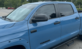 A truck with windows tinted from D and P auto detailing