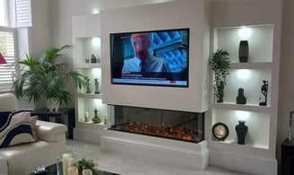 a living room with a television and a fireplace