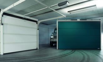 a truck parked in a garage with a green door