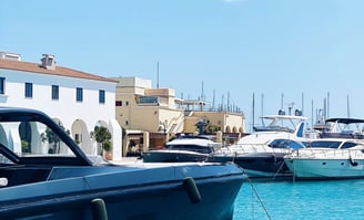 a boat in the water with a boat in the background