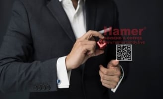 a man in a suit and tie hamer candy
