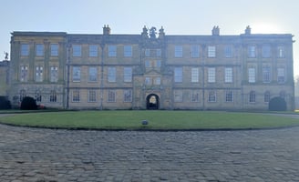 Entrance and front yard of grand mansion