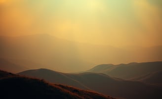 UniverseX - a person standing on a hill with a sky background
