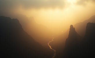UniverseX - a mountain scene with a river and a river