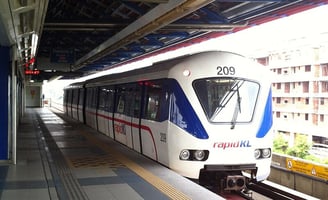 Light rail train at elevated station representing transit connectivity