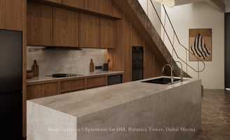 Warm wood kitchen with marble island under staircase, featuring integrated appliances and railing