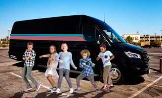 kids outside a party bus