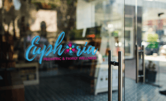 a glass door with a sign that says caprico