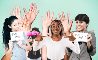 women gesturing with signs and hands asking to be picked